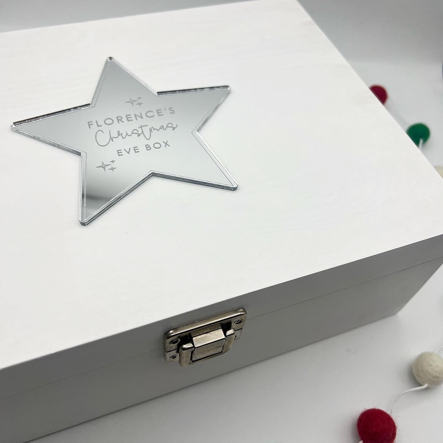 White wooden Christmas Eve box with personalised star