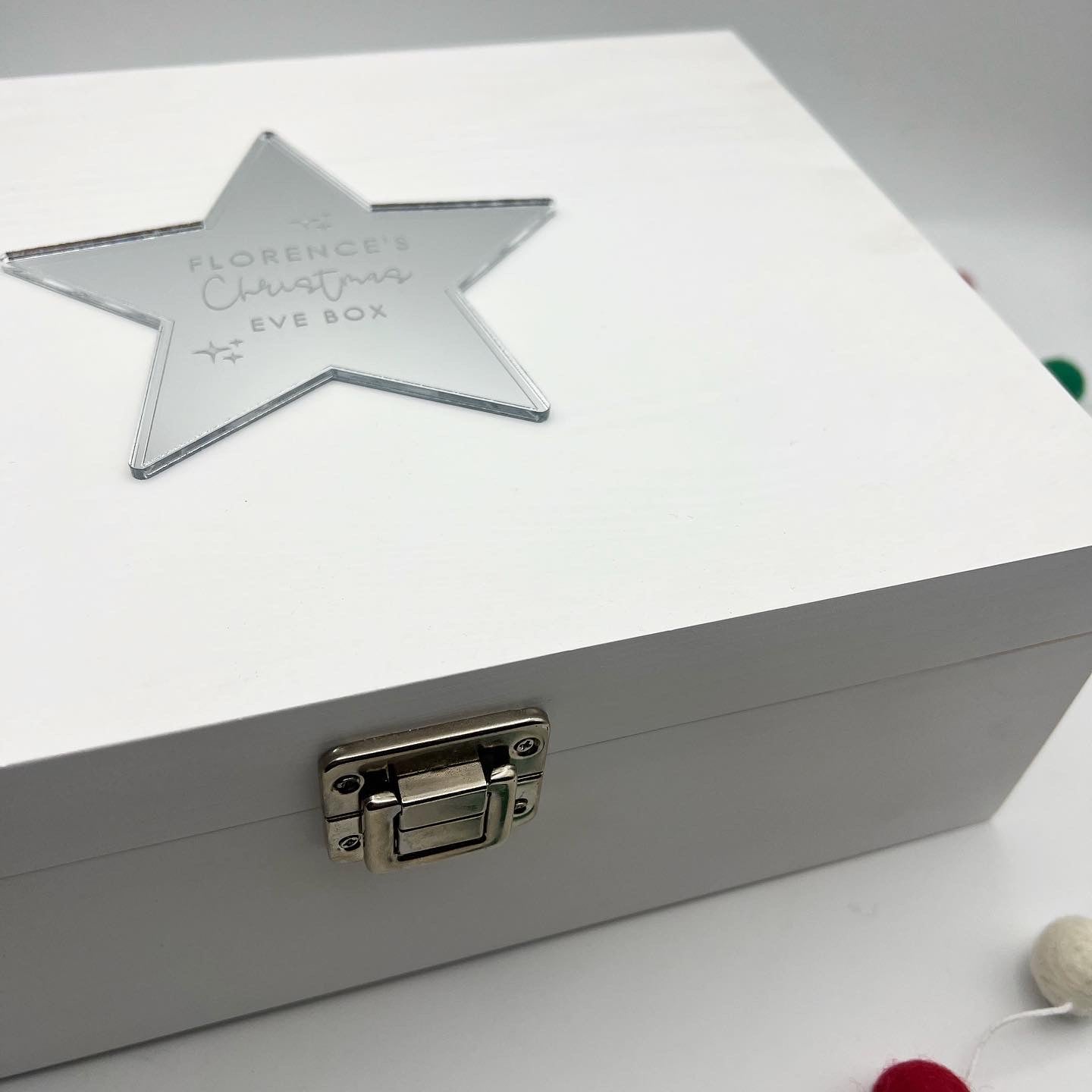 White wooden Christmas Eve box with personalised star