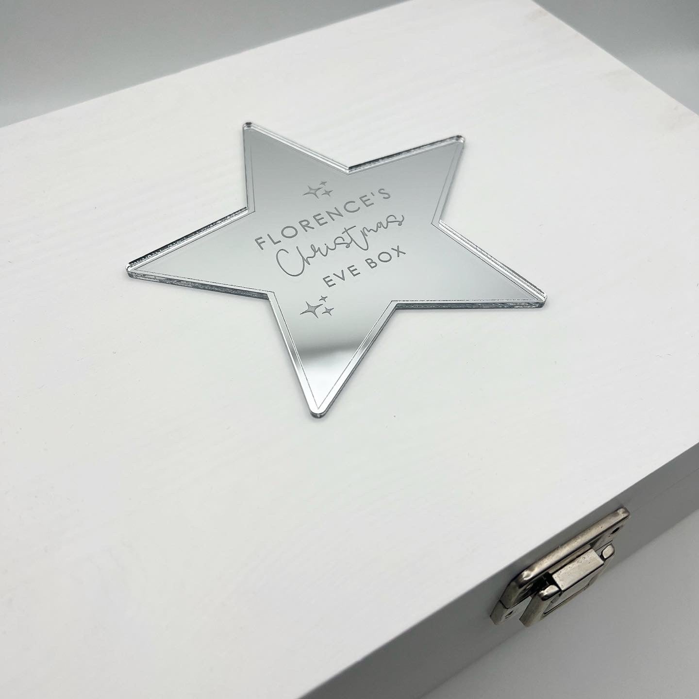 White wooden Christmas Eve box with personalised star